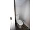 Small bathroom with white toilet and flooring at 1022 W C St, Kannapolis, NC 28081