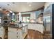 Gourmet kitchen boasts a large island, custom cabinetry, and stainless steel appliances at 178 Stonebridge Dr, New London, NC 28127