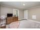 Bedroom with hardwood floors, dresser, and a comfortable bed at 904 Skyland St, Kannapolis, NC 28124