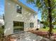 View of back of house, sliding glass doors, and small patio at 3219 Irwin Valley Ct, Charlotte, NC 28269