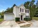 Two-story house with attached garage and well-manicured landscaping at 3219 Irwin Valley Ct, Charlotte, NC 28269