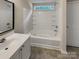 Bathroom with corner tub and built-in shelving at 3219 Irwin Valley Ct, Charlotte, NC 28269