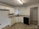 Kitchen features granite countertops and white cabinets at 3219 Irwin Valley Ct, Charlotte, NC 28269