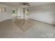 Bright living room with tile floors and a ceiling fan at 3219 Irwin Valley Ct, Charlotte, NC 28269