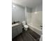Clean bathroom with gray vanity, tub and shower at 560 2Nd St, Chester, SC 29706