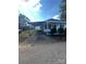 Front view showcasing carport and landscaping at 560 2Nd St, Chester, SC 29706
