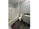 Updated bathroom with gray vanity and tub at 560 2Nd St, Chester, SC 29706