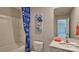 Simple bathroom with a tub shower combo, toilet and single vanity at 7754 Woolsey Dr, Gastonia, NC 28056