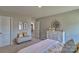 Serene bedroom with a queen-size bed and plenty of natural light at 7754 Woolsey Dr, Gastonia, NC 28056