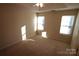 Spacious bedroom with neutral walls and carpet flooring at 4609 Falcon Chase Sw Dr, Concord, NC 28027