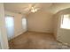 Spacious living room featuring neutral carpeting and a ceiling fan at 4609 Falcon Chase Sw Dr, Concord, NC 28027