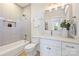 Clean bathroom, featuring a bathtub, shower, and white vanity at 571 Lyttleton Dr, Charlotte, NC 28211