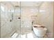 Large bathroom with walk-in shower and soaking tub at 571 Lyttleton Dr, Charlotte, NC 28211