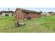 Brick home with a large backyard and central AC unit at 2117 Charlotte Hwy, Mooresville, NC 28117