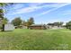 Spacious backyard with large grassy area and storage shed at 2117 Charlotte Hwy, Mooresville, NC 28117