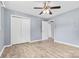 Bedroom with ceiling fan, double closet and access to hallway at 2117 Charlotte Hwy, Mooresville, NC 28117