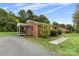 Brick house with a covered porch and walkway at 2117 Charlotte Hwy, Mooresville, NC 28117