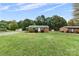 Brick ranch home with a spacious yard and detached shed at 2117 Charlotte Hwy, Mooresville, NC 28117