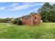 Brick ranch house with a side yard at 2117 Charlotte Hwy, Mooresville, NC 28117