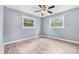 Bright bedroom with ceiling fan and large windows at 2117 Charlotte Hwy, Mooresville, NC 28117