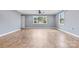 Bright living room with tile floors and multiple windows at 2117 Charlotte Hwy, Mooresville, NC 28117