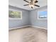 Spacious bedroom with ceiling fan and tile flooring at 2117 Charlotte Hwy, Mooresville, NC 28117