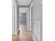Light-filled hallway with tile floors leading to bedrooms at 2117 Charlotte Hwy, Mooresville, NC 28117