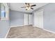 Well-lit bedroom featuring tile floors and double closets at 2117 Charlotte Hwy, Mooresville, NC 28117