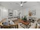 Open concept living room and kitchen with hardwood floors and a leather ottoman at 4004 Crooked Spruce Ct, Matthews, NC 28105