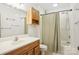 Simple bathroom with a shower/tub combo, vanity, and linen storage at 1080 Harper Gault Rd, Rock Hill, SC 29730