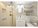 Modern bathroom with a walk-in shower and floating vanity at 3920 Pemberton Dr, Charlotte, NC 28210