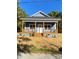 Newly built blue house with a welcoming front porch at 1217 Holland St, Kannapolis, NC 28083