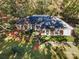 Ranch home surrounded by lush green trees, seen from an elevated perspective at 2643 Rolling Hills Dr, Monroe, NC 28110