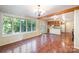 Kitchen features red tile, wood cabinets, and views to dining area at 2643 Rolling Hills Dr, Monroe, NC 28110