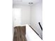 Bright hallway with white door and wood flooring at 1024 W C St, Kannapolis, NC 28081