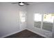 Well lit bedroom with hardwood floors, window, and exterior door at 1024 W C St, Kannapolis, NC 28081