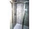 Clean shower with gray tile and blue glass accent at 1024 W C St, Kannapolis, NC 28081