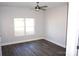 Spacious bedroom with hardwood floors and large double window at 1024 W C St, Kannapolis, NC 28081
