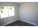 Bright bedroom with large window and wood-look floors at 1024 W C St, Kannapolis, NC 28081