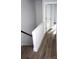 Upper level stairwell with wood-look flooring at 1024 W C St, Kannapolis, NC 28081