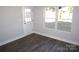 Versatile room with hardwood floors, window, and exterior door at 1024 W C St, Kannapolis, NC 28081