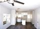Open concept kitchen with white cabinets, stainless steel appliances and an island at 1024 W C St, Kannapolis, NC 28081