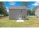 Gray house with a small backyard and patio at 2612 Senior Dr, Charlotte, NC 28216