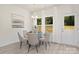 Bright dining area with glass table and seating for six at 2612 Senior Dr, Charlotte, NC 28216