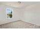 Bright bedroom with a large window and neutral decor at 2612 Senior Dr, Charlotte, NC 28216