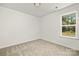 Spacious bedroom with a window and neutral wall decor at 2612 Senior Dr, Charlotte, NC 28216