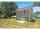 Gray house with a small backyard and patio at 2612 Senior Dr, Charlotte, NC 28216
