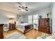 Bedroom with dresser, desk and ceiling fan at 1725 Deer Run Rd, Catawba, SC 29704