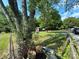 Large backyard with shed, mature trees, and chain link fence at 3730 Birchdale Ct, Matthews, NC 28104