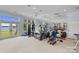 Bright recreation room with lake views and various workout equipment at 18210 Pompano Pl, Cornelius, NC 28031